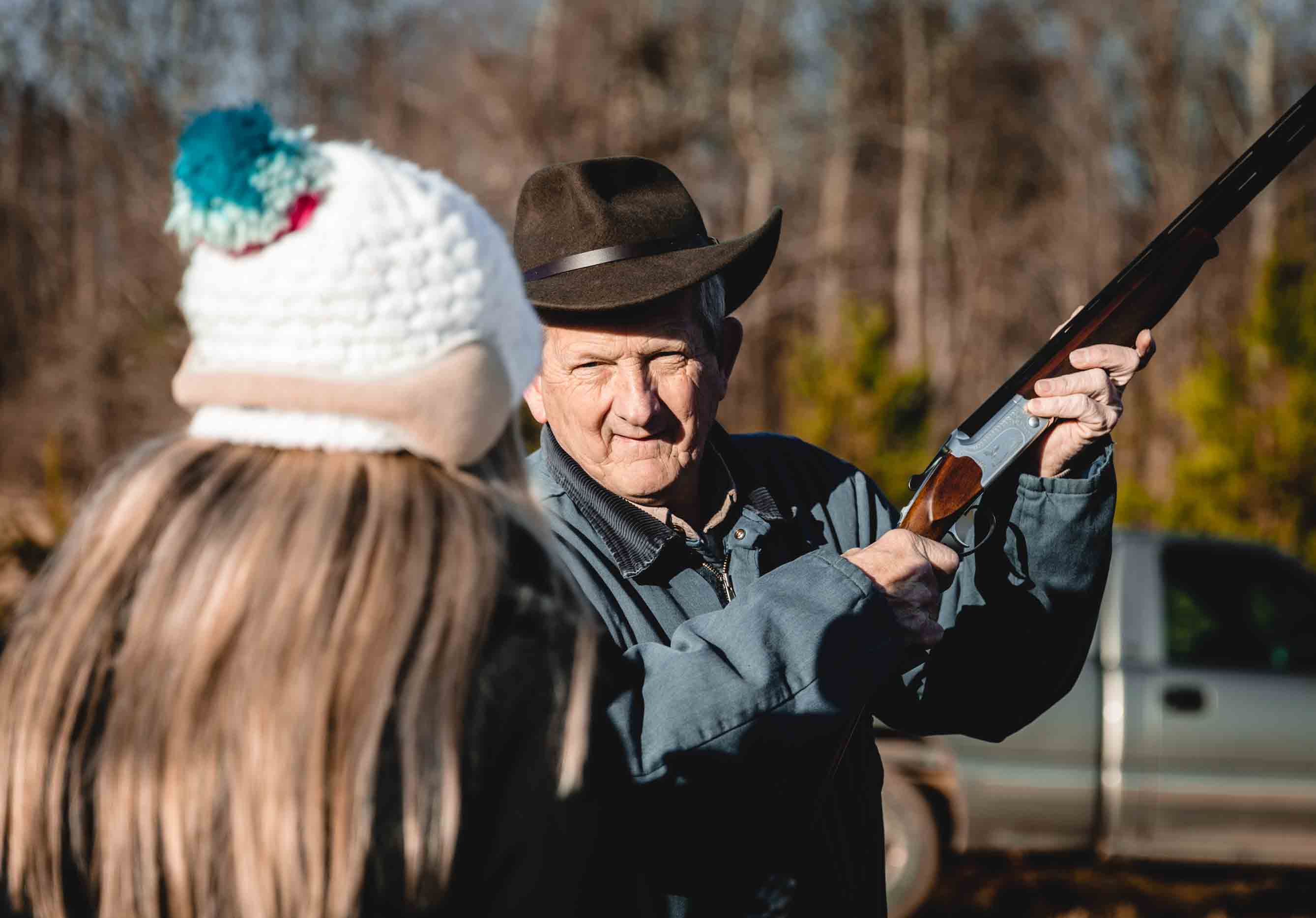 Older Man Showing a Teen Girl How to Shoot a Shotgun Atlanta GA