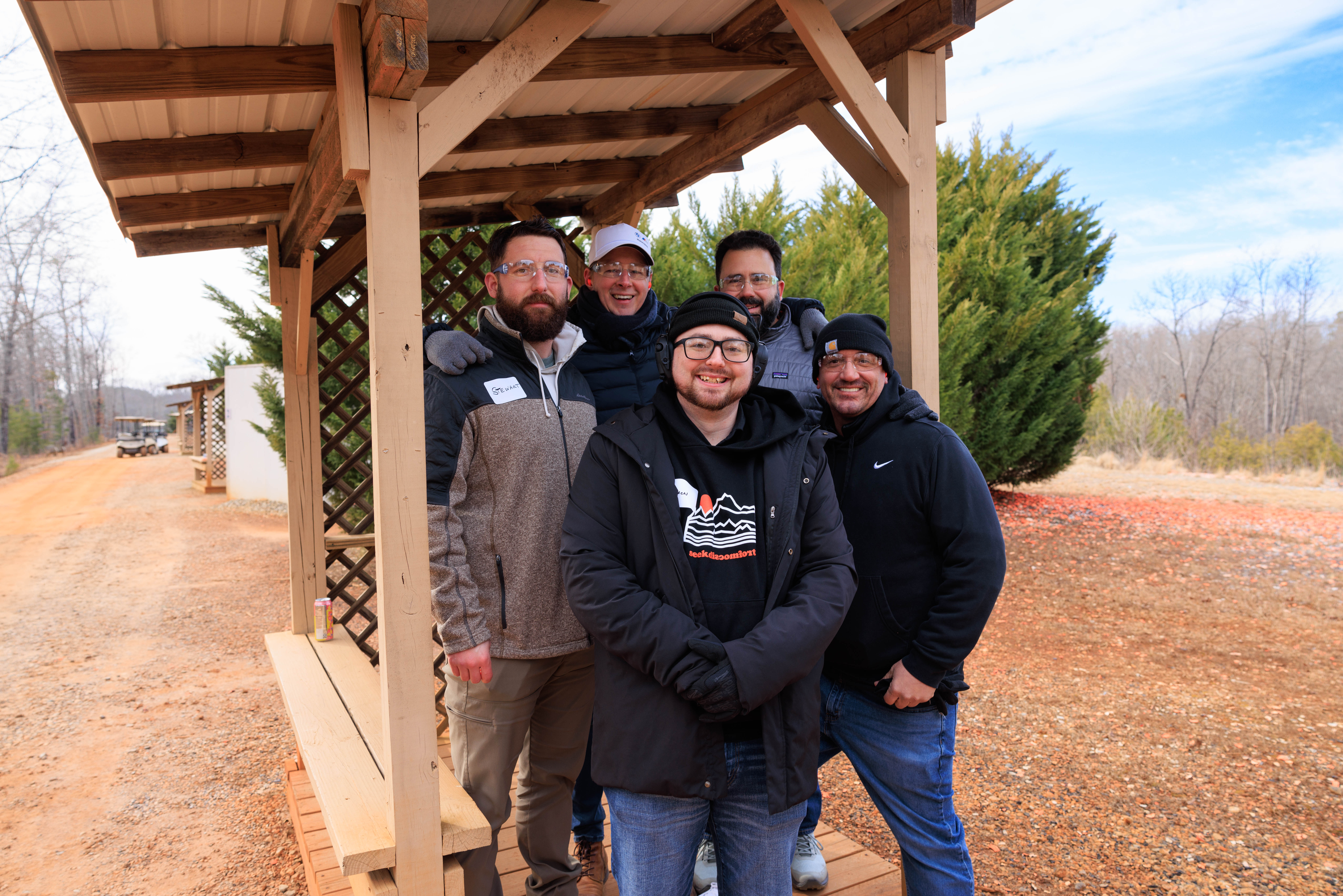Group aiming at targets during corporate retreat in Dawsonville GA
