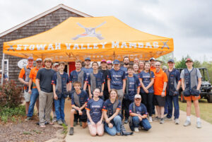 A group photo of the 2026 Etowah Valley Mambas sporting clays team in front of the EVSC lodge in Dawsonville, GA.